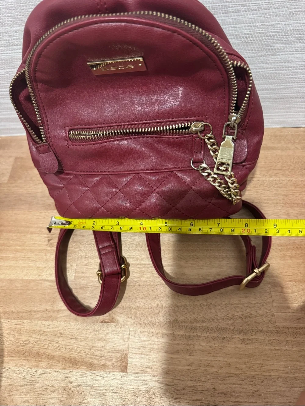 bebe Small Quilted Backpack in Burgundy with Gold Chain